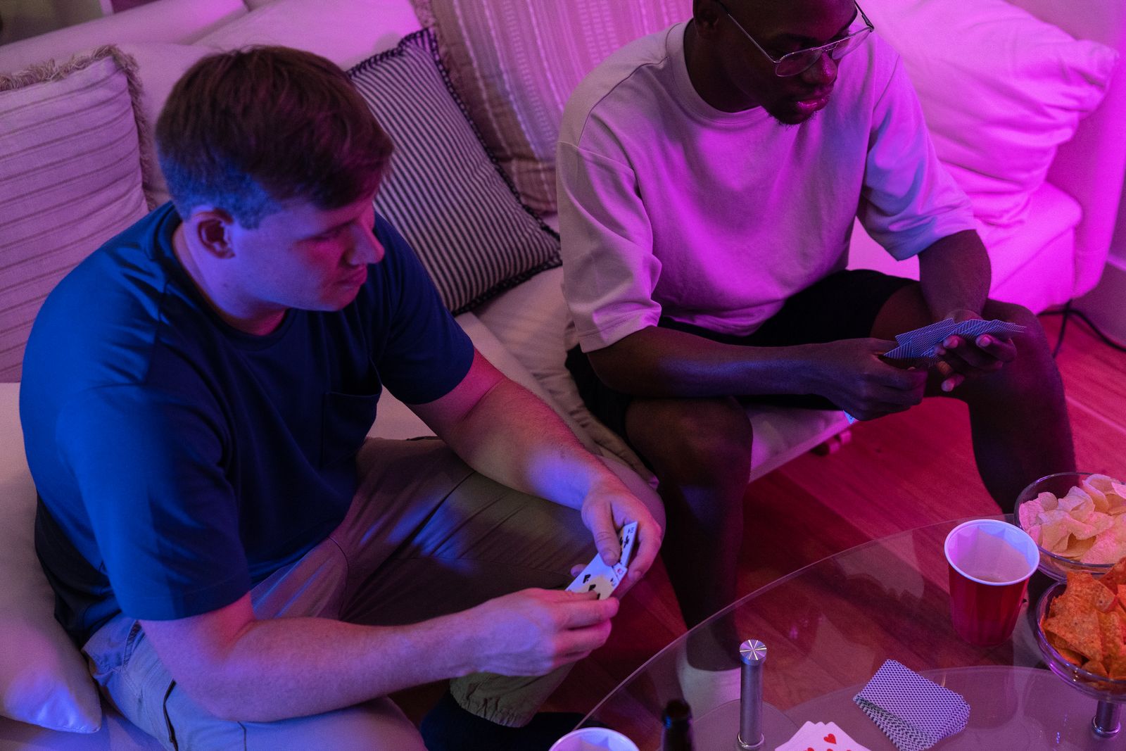 Two friends enjoying a casual card game at home